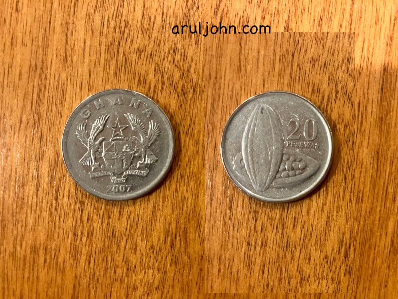Ghana coin worth 20 pesawas in Aldi shopping cart