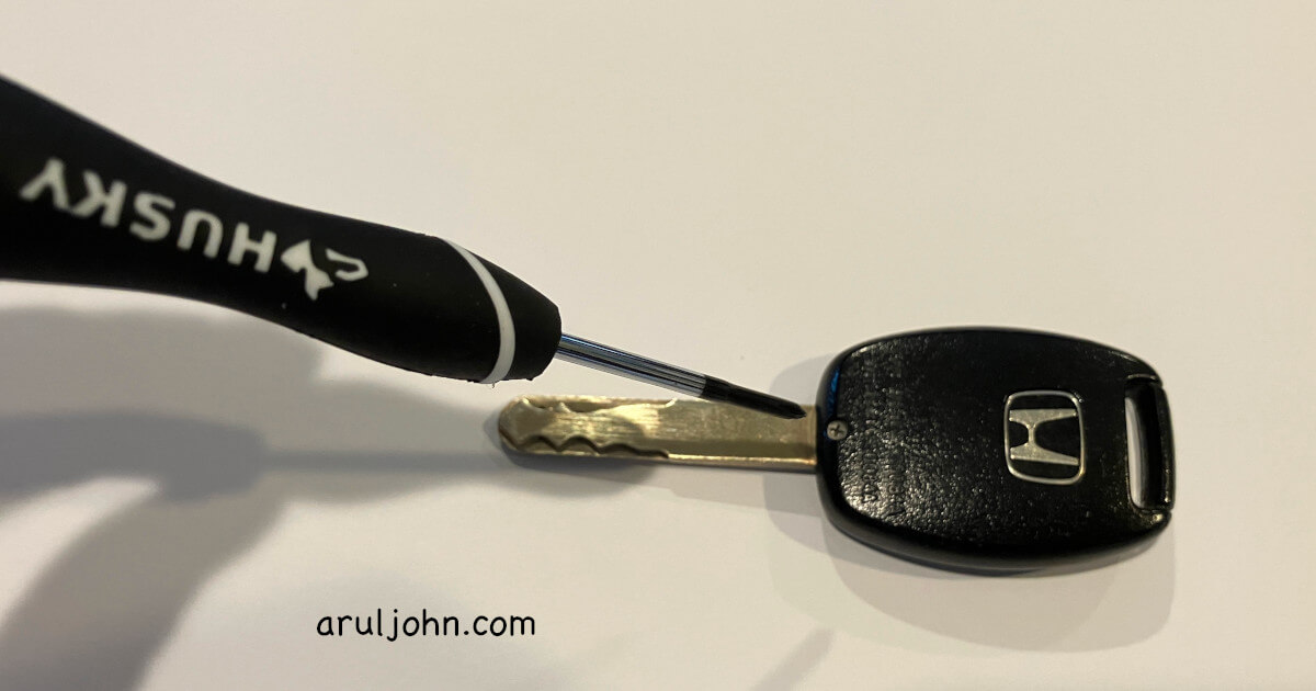 Open key fob using screwdriver